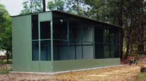 conventional aviary on cement block